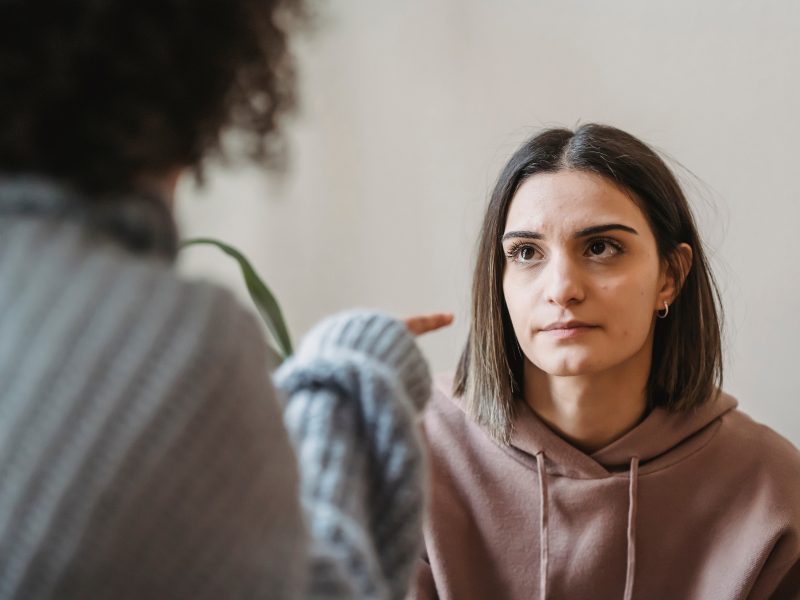 woman talking to another woman and looks like she is yelling
