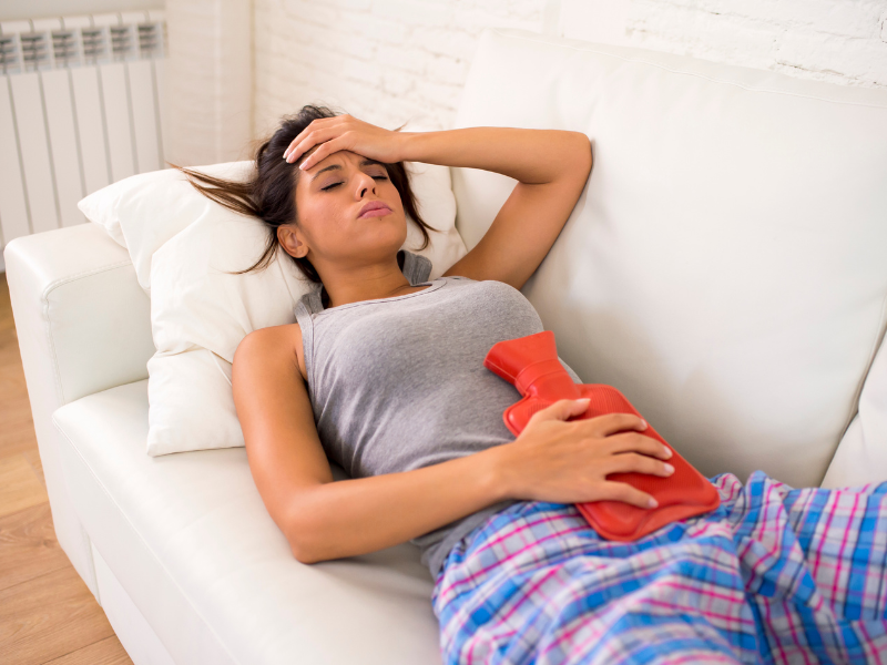 period pain-woman with heating pad